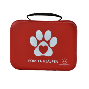 En röd första hjälpen väska med ett vitt tassavtryck.