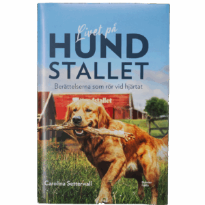 En bok med en hund som håller en pinne i munnen.