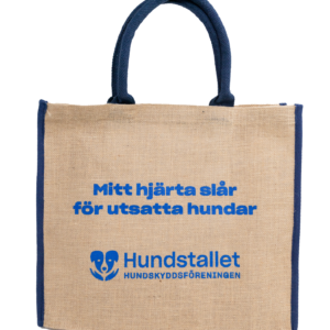 En juteväska med blått handtag.